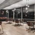 Con chairs with veneer backrest and Myk table at Fora Form